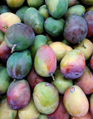 pexels photo 2363345 2363345 A vibrant collection of ripe mangoes stacked showcasing fresh produce.